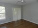 Bedroom with hardwood floors and sliding glass doors at 201 Cypress Pond Rd # 201, Palm Harbor, FL 34683
