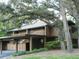 Condo building nestled amongst lush trees at 201 Cypress Pond Rd # 201, Palm Harbor, FL 34683