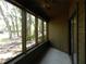 Relaxing screened porch overlooking the wooded area and providing natural light at 201 Cypress Pond Rd # 201, Palm Harbor, FL 34683