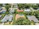 Aerial view of a residential neighborhood with houses and swimming pools at 3122 Lake Valencia E Ln, Palm Harbor, FL 34684