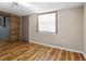 Living room with wood-look floors and neutral walls at 4822 3Rd S Ave, St Petersburg, FL 33711