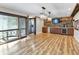 Spacious game room with hardwood floors, a wet bar, and large TV at 4822 3Rd S Ave, St Petersburg, FL 33711