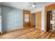 Bedroom with wood-paneled accent wall, and hardwood floors at 4822 3Rd S Ave, St Petersburg, FL 33711