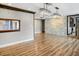 Bright dining room with hardwood floors and a stone feature wall at 4822 3Rd S Ave, St Petersburg, FL 33711