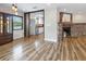 Open concept living room with hardwood floors and kitchen view at 4822 3Rd S Ave, St Petersburg, FL 33711