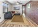 Living room with wood floors, exposed brick wall, and comfortable seating at 4822 3Rd S Ave, St Petersburg, FL 33711