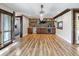 Game room features hardwood floors, a bar area, and a wall-mounted TV at 4822 3Rd S Ave, St Petersburg, FL 33711