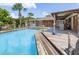 Inviting pool with spacious deck and tropical landscaping at 4822 3Rd S Ave, St Petersburg, FL 33711