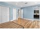 Light blue bedroom with hardwood floors and built-in closet at 4822 3Rd S Ave, St Petersburg, FL 33711