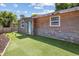 Charming bungalow with stone and wood siding, artificial turf at 4822 3Rd S Ave, St Petersburg, FL 33711
