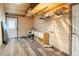 Laundry room with wood walls, hanging clothes rack, and storage at 4822 3Rd S Ave, St Petersburg, FL 33711