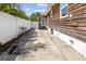 Side yard with wooden fence and concrete patio at 4822 3Rd S Ave, St Petersburg, FL 33711