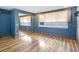 Bright bedroom featuring wood floors and mirrored closet doors at 4822 3Rd S Ave, St Petersburg, FL 33711