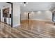 Spacious living room with hardwood floors and a view of the kitchen at 4822 3Rd S Ave, St Petersburg, FL 33711