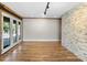Bright and airy common area with stone wall and hardwood floors at 4822 3Rd S Ave, St Petersburg, FL 33711