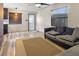 Open living room with wood floors and access to the kitchen at 4822 3Rd S Ave, St Petersburg, FL 33711
