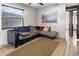 Spacious living room with a comfortable sectional sofa and large window at 4822 3Rd S Ave, St Petersburg, FL 33711