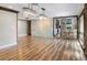 Dining room with hardwood floors and stone accent wall, open to kitchen at 4822 3Rd S Ave, St Petersburg, FL 33711