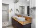 Modern bathroom with double vanity, large mirrors, and a walk-in shower at 4822 3Rd S Ave, St Petersburg, FL 33711