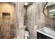 Simple bathroom with wood-look tile and a walk-in shower at 4822 3Rd S Ave, St Petersburg, FL 33711
