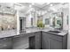 Contemporary bathroom with a floating vanity and large mirrors at 4822 3Rd S Ave, St Petersburg, FL 33711