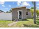 Front view of a cozy single-story home with a fenced yard at 4822 3Rd S Ave, St Petersburg, FL 33711