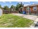 Large backyard with wooden gate and driveway at 4822 3Rd S Ave, St Petersburg, FL 33711