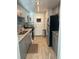 Modern kitchen with gray cabinets and granite countertops at 7200 Sunshine Skyway S Ln # 7E, St Petersburg, FL 33711
