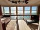 Sunroom with stunning water views and exercise equipment at 7200 Sunshine Skyway S Ln # 7E, St Petersburg, FL 33711