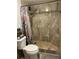 Bathroom with walk-in shower and tiled walls at 7200 Sunshine Skyway S Ln # 7E, St Petersburg, FL 33711