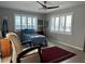 Cozy bedroom with water views and a comfortable chair at 7200 Sunshine Skyway S Ln # 7E, St Petersburg, FL 33711