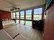 Spacious sunroom with daybed and panoramic water views at 7200 Sunshine Skyway S Ln # 7E, St Petersburg, FL 33711