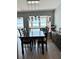 Elegant dining room with water views and modern chandelier at 7200 Sunshine Skyway S Ln # 7E, St Petersburg, FL 33711
