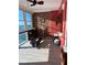 Bright sunlit room with ocean views, featuring a Pilates reformer and exercise ball at 7200 Sunshine Skyway S Ln # 7E, St Petersburg, FL 33711