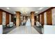 Elegant building lobby with seating and chandelier at 7200 Sunshine Skyway S Ln # 7E, St Petersburg, FL 33711