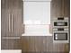Modern kitchen with stainless steel appliances and dark wood cabinets at 777 3Rd N Ave # 1204, St Petersburg, FL 33701