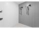Large shower with gray and white tile and multiple shower heads at 777 3Rd N Ave # 1204, St Petersburg, FL 33701