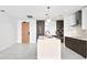 Modern kitchen with island, stainless steel appliances, and dark wood cabinetry at 777 3Rd N Ave # 1204, St Petersburg, FL 33701
