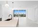 Contemporary kitchen features a large island and city views at 777 3Rd N Ave # 1204, St Petersburg, FL 33701