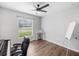 Bright home office features wood floors, window with blinds, and built-in workspace at 2193 Peake St, North Port, FL 34286