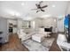 Spacious living room with sectional sofa and large TV at 2193 Peake St, North Port, FL 34286