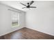 Spacious bedroom with wood floors and a ceiling fan at 2193 Peake St, North Port, FL 34286