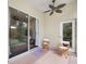 Relaxing screened porch with ceiling fan and patio furniture at 2193 Peake St, North Port, FL 34286