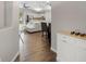 Entryway looking toward an open concept living and kitchen area at 2193 Peake St, North Port, FL 34286