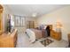 Cozy bedroom with comfy bed, ceiling fan, dresser, and natural light at 660 Island Way # 401, Clearwater, FL 33767