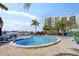 Enjoy the outdoors with this beautiful in-ground pool and lounge chairs; a perfect oasis near the community at 660 Island Way # 401, Clearwater, FL 33767