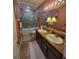 Bathroom with double sinks, granite countertop, and shower/tub combo at 7607 55Th E St, Ellenton, FL 34222