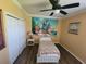 bedroom with twin bed, mural, and ceiling fan at 7607 55Th E St, Ellenton, FL 34222