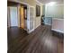 Spacious hallway with doors to other rooms and dark flooring at 7607 55Th E St, Ellenton, FL 34222