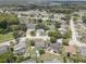 Birds-eye view of home, neighborhood, and pond at 4541 Whitetail Ln, New Port Richey, FL 34653